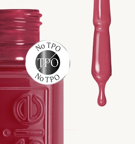 A close-up of a essie nail polish in shade "Mrs. Always Right" with a "No TPO" safety seal and a droplet of matching polish.