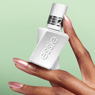 hand holding Gel by essie Shiny Top Coat 
