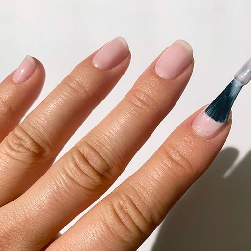 Applying base sheer nail polish for french manicure - Essie