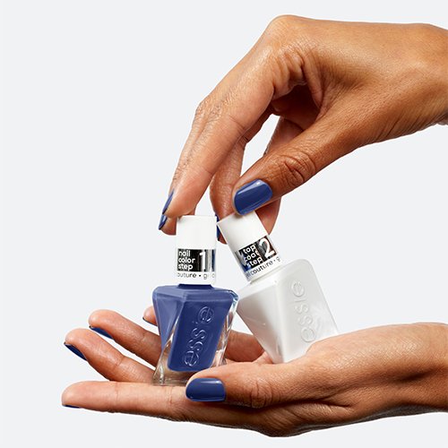 Medium skin hands, one below holding the two bottles of the gel nail system, one above touching them