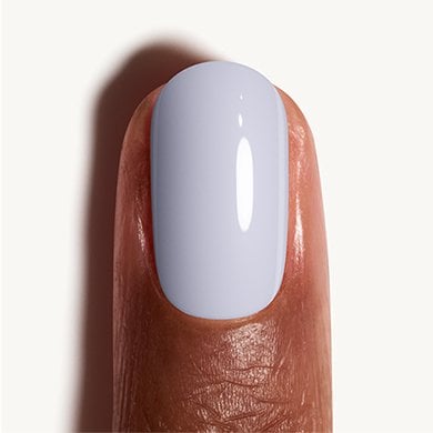Closeup of dark skin fingernail wearing periwinkle powder blue Perfect Posture essie polish