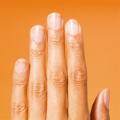Medium skin hand on orange background with all fingers pointing straight up