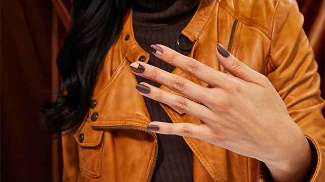 woman with multi-brown nail polish manicure in geometric patterns