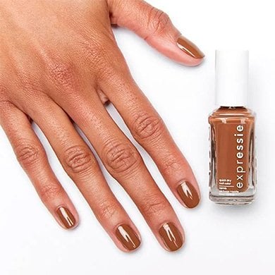 hand holding essie cold brew crew nail polish on a white background
