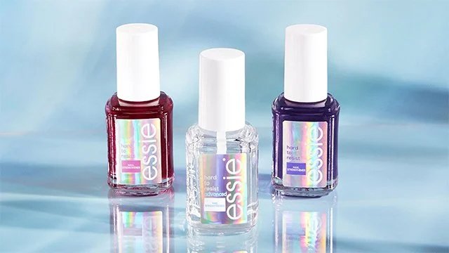 Three essie nail strengtheners against a blue and white background