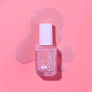 bottle of essie's good as new nail perfector against a bright pink background