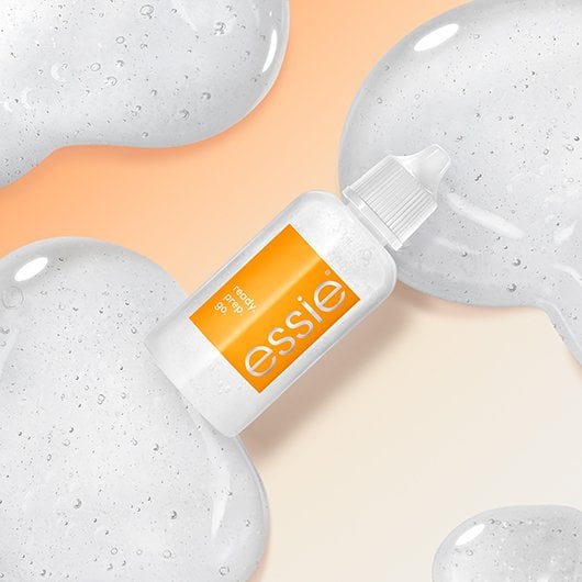bottle of essie's 3-in-1 cuticle remover surrounded by swatches
